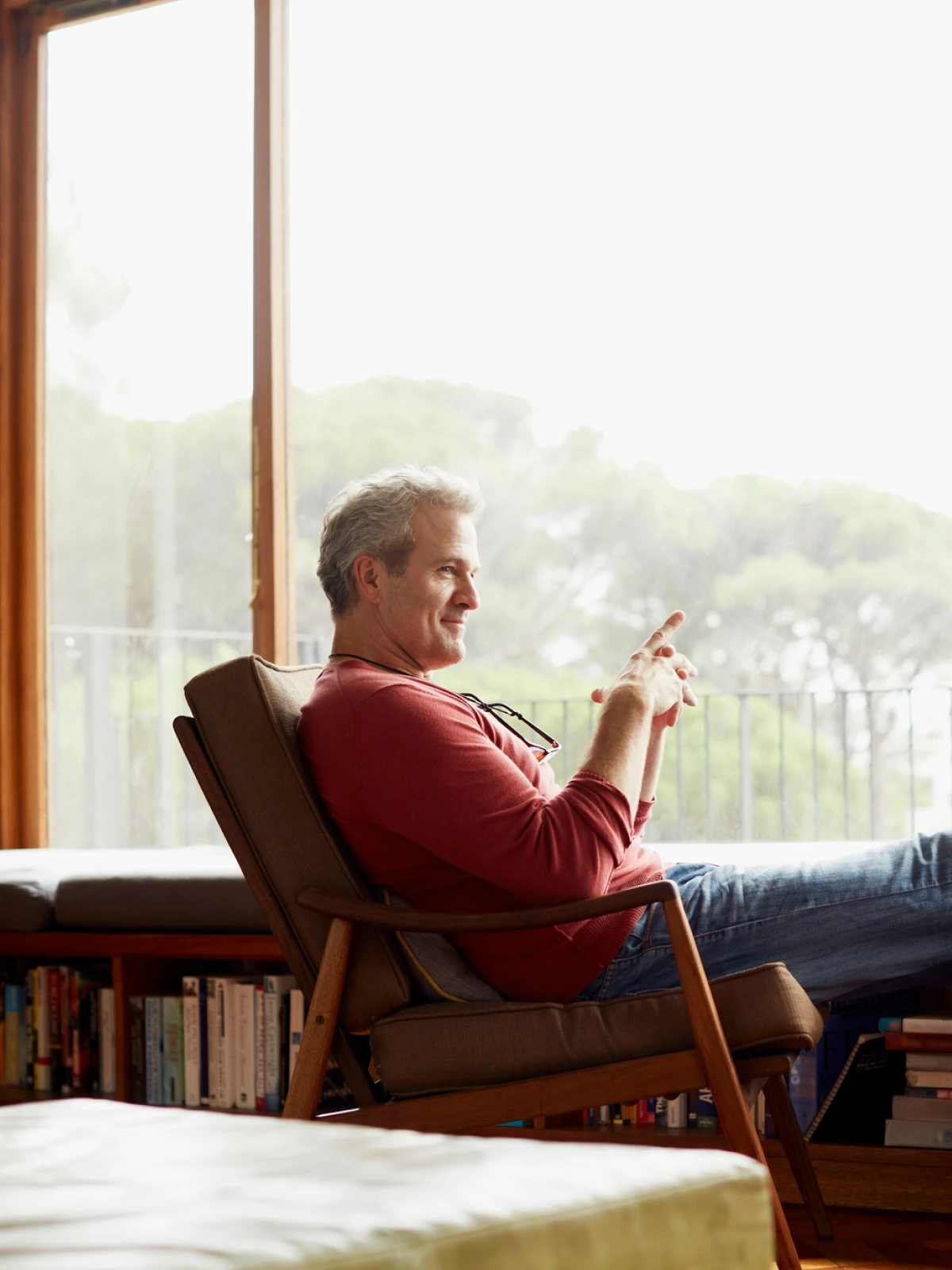 Mature man relaxing by the window.